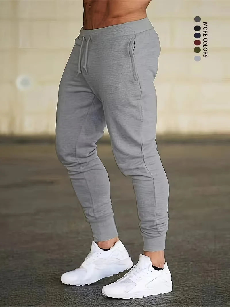 Men's and women's solid color sports running pants are designed specifically for sports and hiking featuring a drawstring design