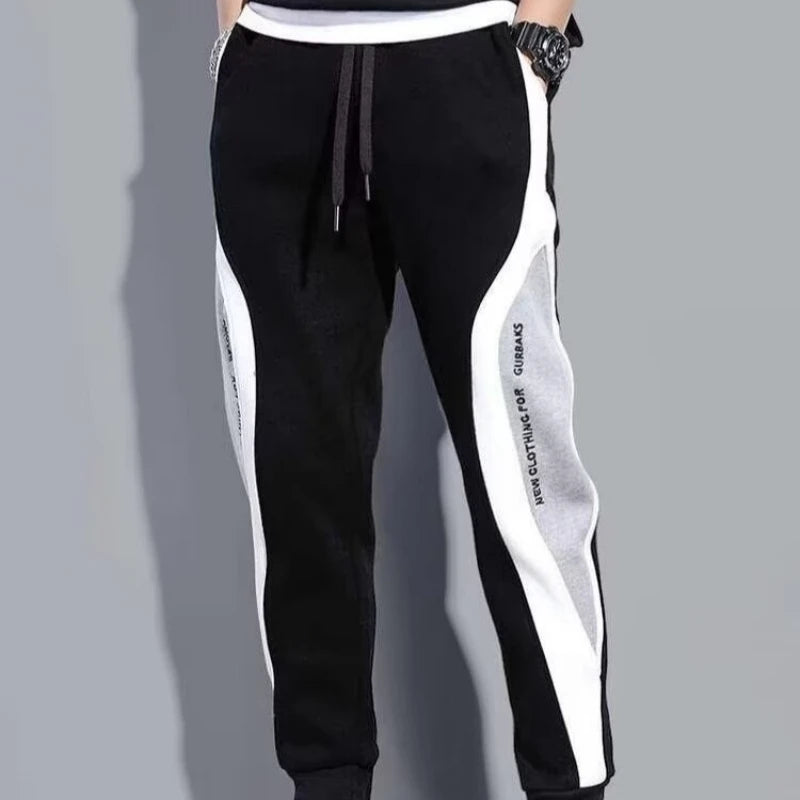 Jogging Suit Overview Style: Modern athletic fit — tailored but not tight, offering mobility and a clean silhouette. Material: Jacket and Pants: Premium moisture-wicking, breathable polyester blend with 10–20% spandex for