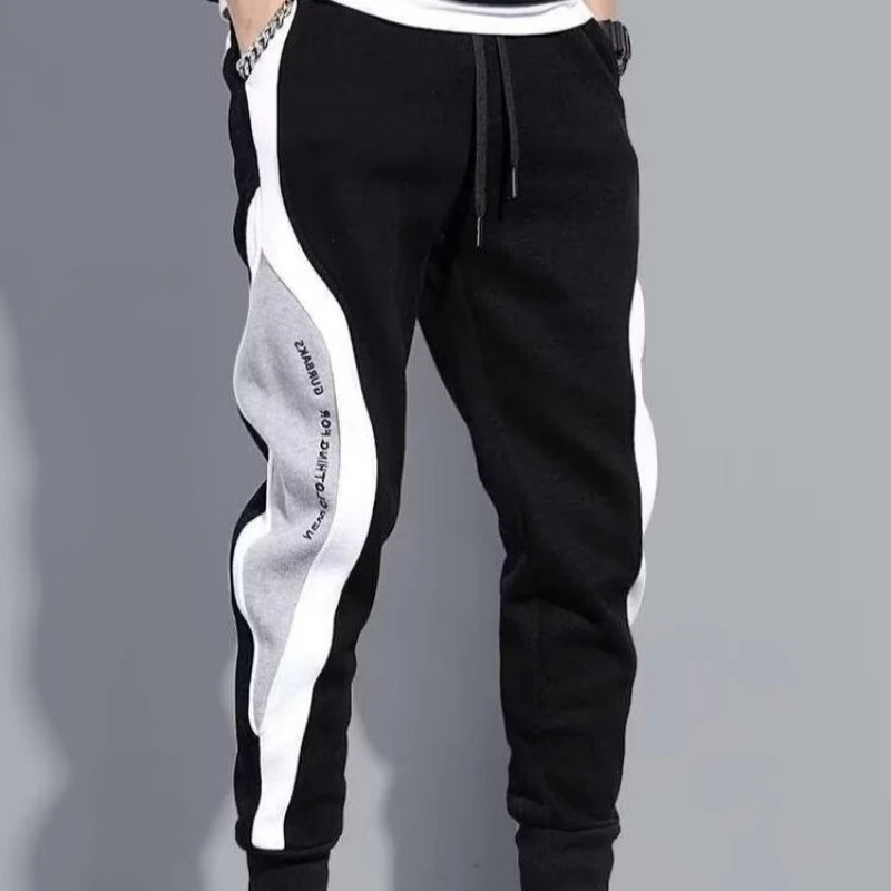 Jogging Suit Overview Style: Modern athletic fit — tailored but not tight, offering mobility and a clean silhouette. Material: Jacket and Pants: Premium moisture-wicking, breathable polyester blend with 10–20% spandex for