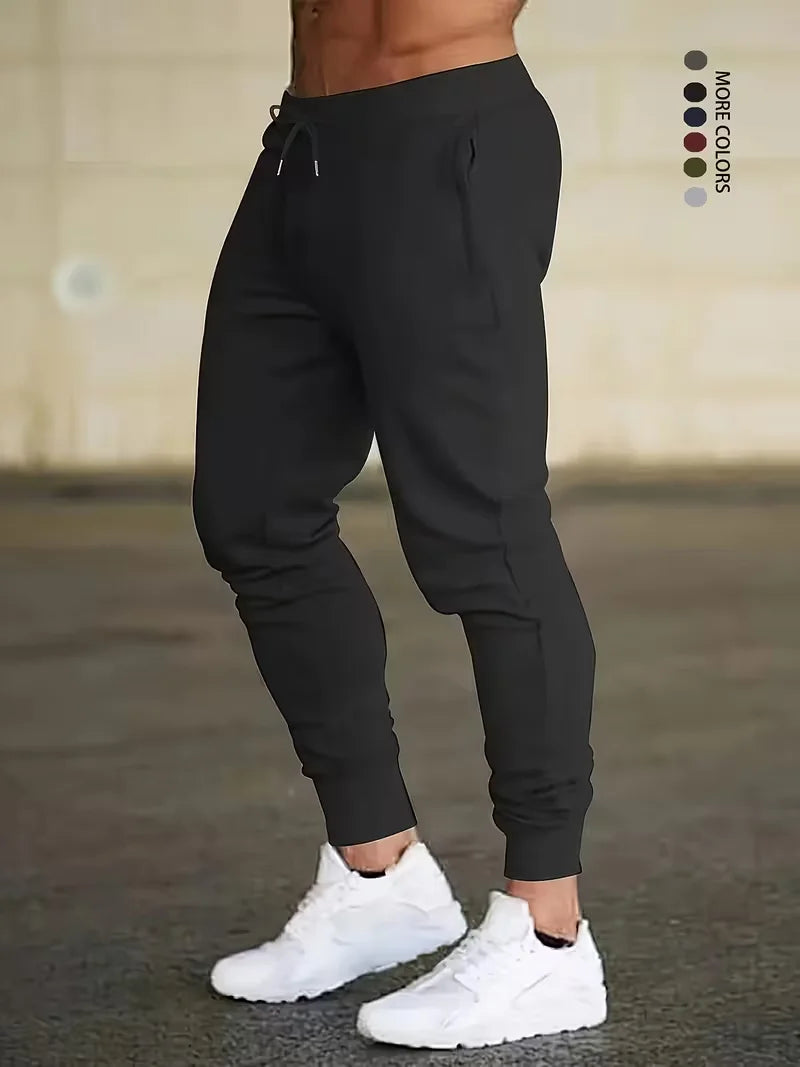 Men's and women's solid color sports running pants are designed specifically for sports and hiking featuring a drawstring design