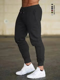 Men's and women's solid color sports running pants are designed specifically for sports and hiking featuring a drawstring design