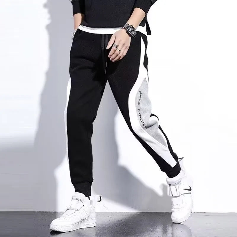 Jogging Suit Overview Style: Modern athletic fit — tailored but not tight, offering mobility and a clean silhouette. Material: Jacket and Pants: Premium moisture-wicking, breathable polyester blend with 10–20% spandex for